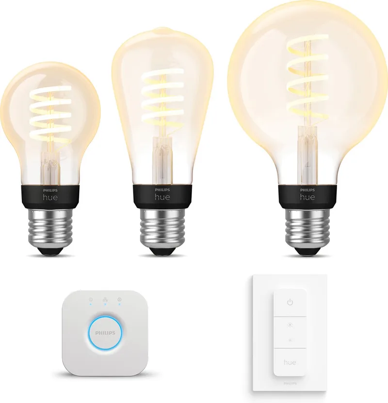 Starterspakket - E27 - met 3 Filament Lampen Mix - Warm tot Koelwit Licht - Incl. 1 Hue Bridge, 1 Hue Dimmer Switch - Hue White Ambiance Filament fra Philips Hue i Guld – produktbillede