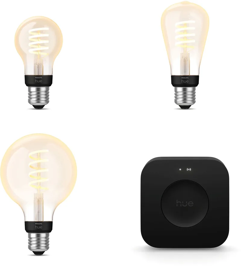 Starterspakket - E27 - met 3 Filament lampen Mix - Warm tot Koelwit Licht - Incl. 1 Hue Bridge Pro - Hue White Ambiance Filament från Philips Hue i Guld – produktbild