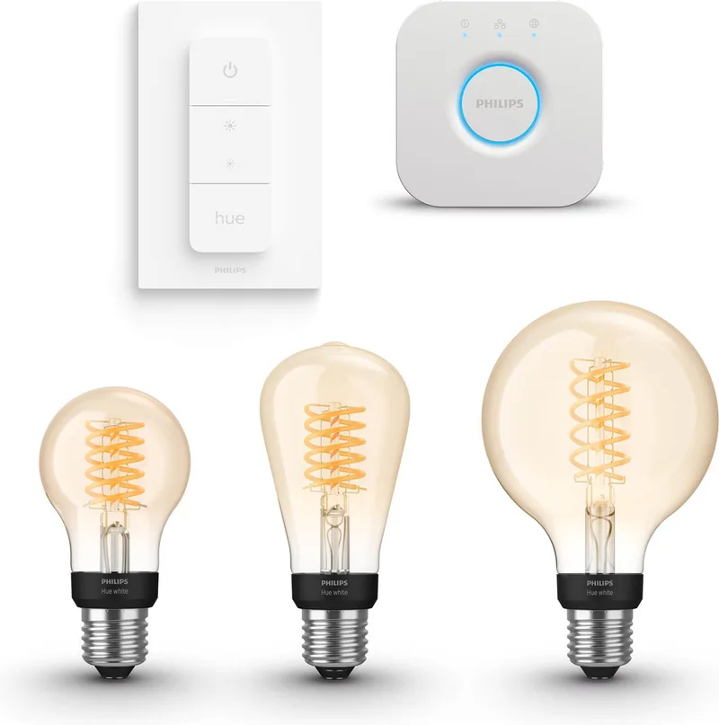 Starterspakket - E27 - met 3 Filament Lampen Mix - Warmwit Licht - Incl. 1 Hue Bridge, 1 Hue Dimmer Switch - Hue White Filament by Philips Hue in Gold – product photo