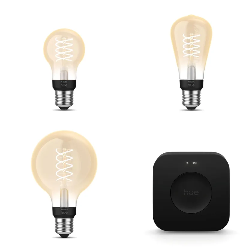 Starterspakket - E27 - met 3 Filament lampen Mix - Warmwit Licht - Incl. 1 Hue Bridge Pro - Hue White Filament by Philips Hue in Gold – product photo