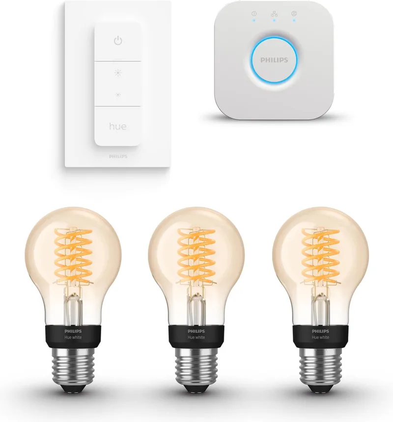 Starterspakket - E27 - met 3 Filament Standaard Lampen (A60) - Warmwit Licht - Incl. 1 Hue Bridge, 1 Hue Dimmer Switch - Hue White Filament från Philips Hue i Guld – produktbild